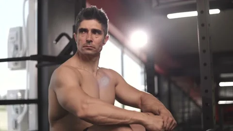 Athletic middle aged man relaxing indoors after training. Video stock 201405725
