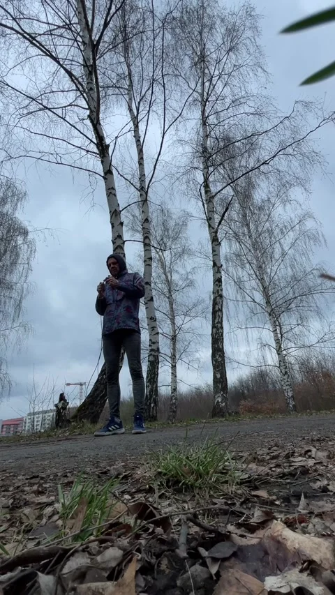 Athletic morning exercise. Man performs vertical jump workout outdoors Видео 347335194