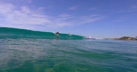 Athletic professional surfer riding an ocean wave on surfboard in Australian bea Stock Footage 199459956