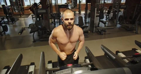 Athletic runner man running on treadmill, aerobics and endurance training in gym Stock Footage 205515378