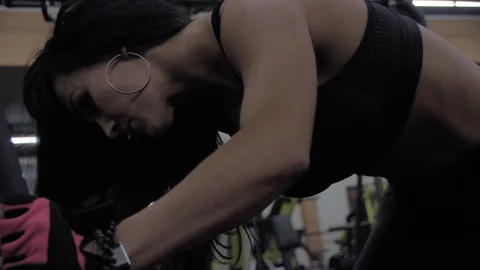Athletic sexy girl performs exercise legs back Stock Footage 125907703