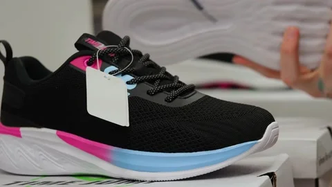 Athletic shoes on the shelf in the store. Stock Footage 229295108