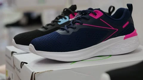 Athletic shoes on the shelf in the store. Stock Footage 229295358