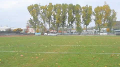 Athletic stadium in fall. Abandoned athletics stadium in autumn. Panoramic view 動画素材 164456934