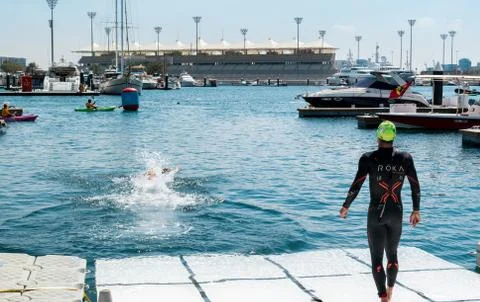 Athletic swimmer getting ready to dive in Stock Photos