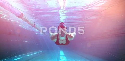 Athletic swimmer training on her own Stock Photos