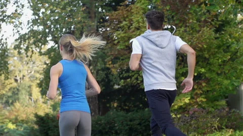 Athletic Urban Joggers Run Through Autumn Colored Park Stock Footage 42162138