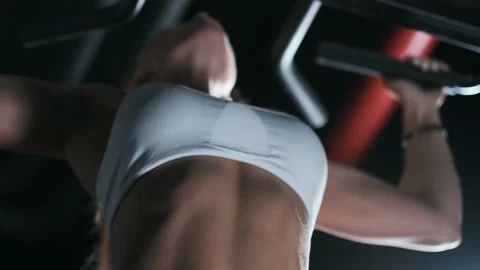 Athletic woman doing pull-ups Stock Footage 142279775