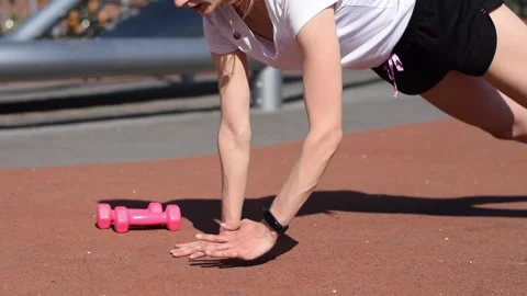 Athletic woman doing a push ups on the playground. Stock Footage 154846270