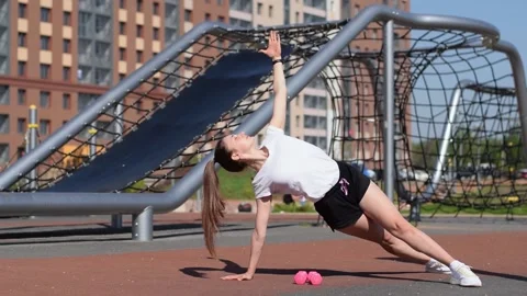 Athletic woman doing side plank exercise. Stock Footage 154846204