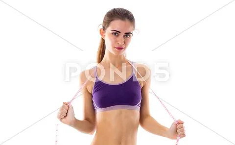 Athletic woman holding cantimeter Stock Photos