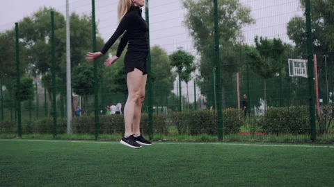 Athletic woman jumping. Stock Footage 145360342