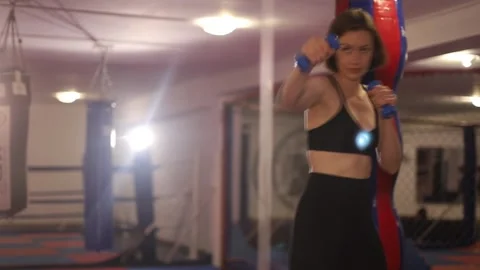 Athletic woman practicing punches while training in the gym. Stock Footage 136402483
