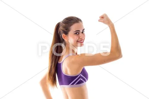 Athletic woman showing her biceps Stock Photos