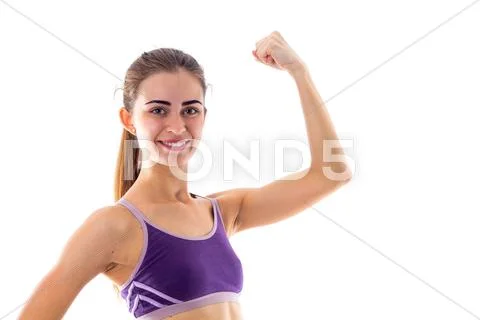 Athletic woman showing her biceps Stock Photos