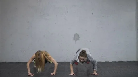 Athletic women performing burpee exercise Stock Footage 72485698