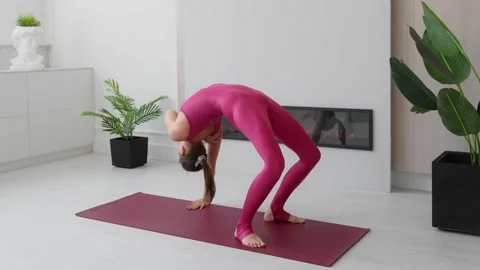 Athletic young female exercising, stretching and doing yoga in morning Stock Footage 248644476