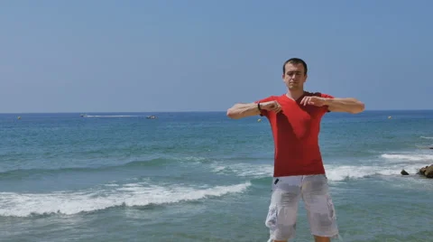 Athletic, young, healthy, handsome, white man warming up his body before the Stock-Footage 64891813