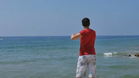 Athletic, young, healthy, handsome, white man warming up his body before the Видео 64899697