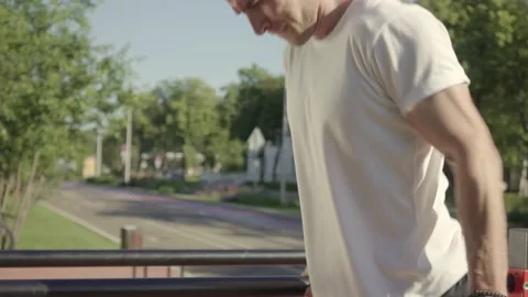 Athletic young man doing parallel bar dips on urban sports ground Stock-Footage 146307067