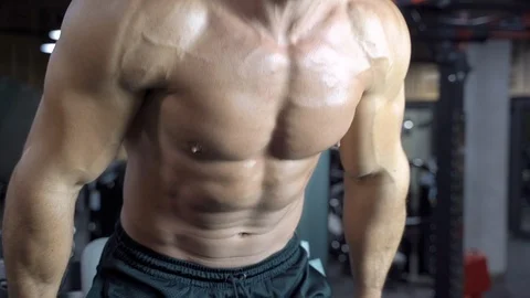 Athletic young man doing pulling up on horizontal bar at gym. Stock Footage 108832335