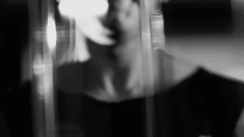 Athletic young man exercising on a block device. Black-and-white shot Stock-Footage 73988128