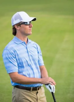 Athletic young man playing golf Foto stock