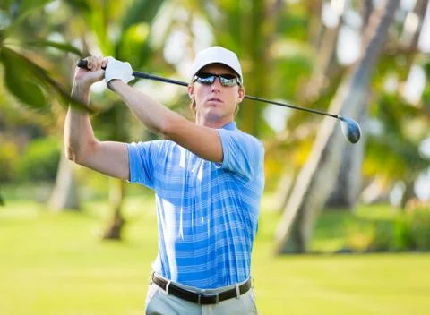 Athletic young man playing golf 스톡 사진