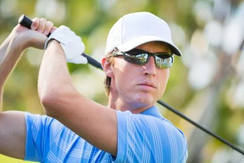 Athletic young man playing golf Foto stock