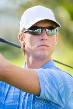 Athletic young man playing golf 스톡 사진