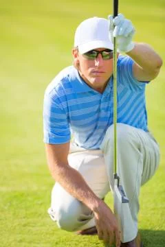 Athletic young man playing golf Foto stock