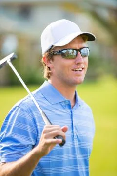Athletic young man playing golf 스톡 사진