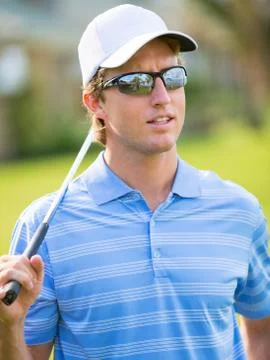 Athletic young man playing golf 스톡 사진