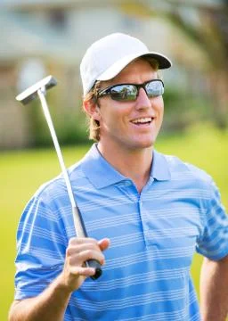 Athletic young man playing golf Foto stock