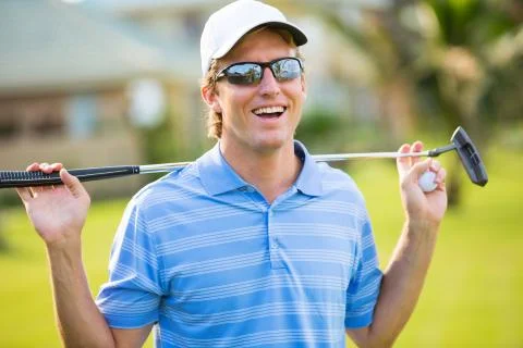 Athletic young man playing golf 스톡 사진