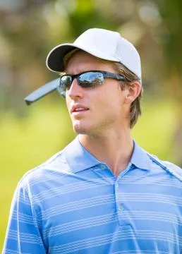 Athletic young man playing golf 스톡 사진