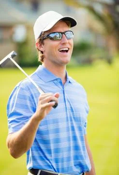 Athletic young man playing golf Stock Photos