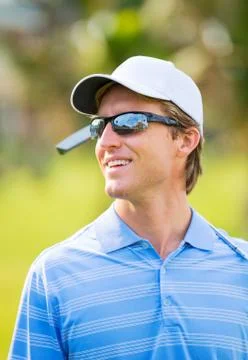 Athletic young man playing golf Stock Photos