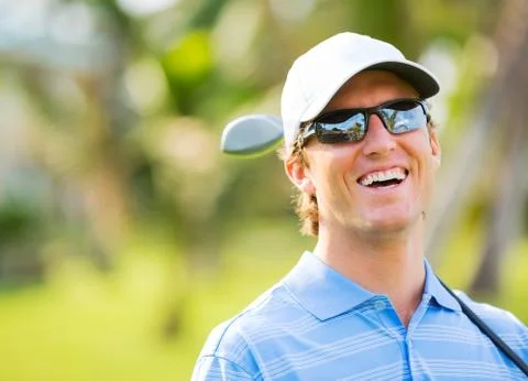 Athletic young man playing golf Stock Photos