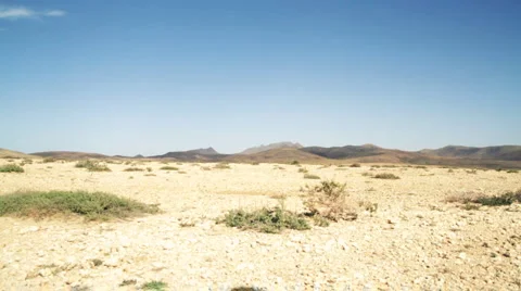 Athletic young man running at the desert, slow motion  스톡 동영상 1089285