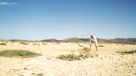 Athletic young man running at the desert, slow motion Stock Footage 1089336
