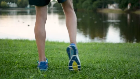 Athletic young man strething, preparing for marathon long distane run outdoors 動画素材 93306508