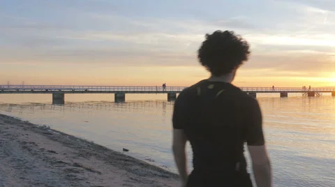 Athletic young man in sunset do gesture of success Stockbeeldmateriaal 51467331