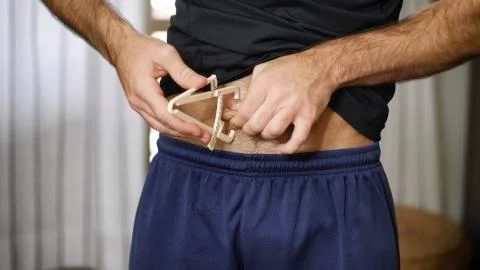 Athletic young man using plicometer Stock Photos