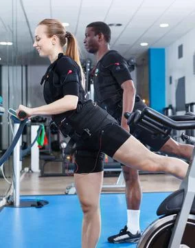 Athletic young people during functional workout with electric muscle stimulation 스톡 사진