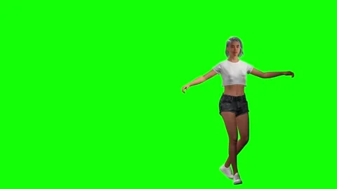 Athletic young woman dancing dynamically on green screen chromakey Stock Footage 328637136