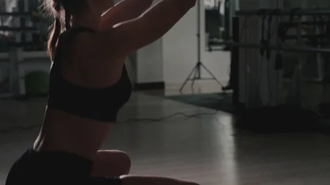 Athletic young woman doing exercise with the TRX loops, and trains the muscles Stock Footage 119052912