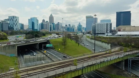 Atlanta Cityscape with traffic jam on interstate 75 during cloudy day. Aerial Stock-Footage 306064318