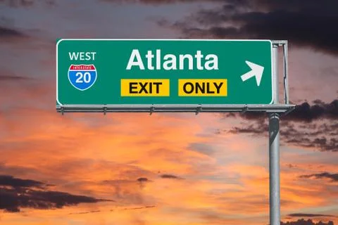 Atlanta Exit Only Freeway Sign with Sunrise Sky Stock Photos