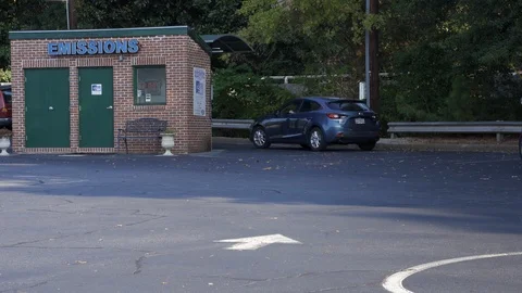 ATLANTA-SEPTEMBER 11: An emissions testing site with an arriving customer on  Stock Footage 115977676